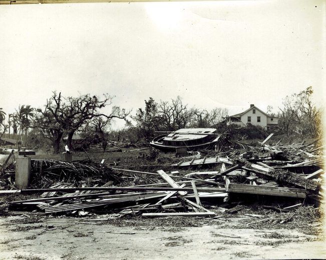 Debris among homes and trees